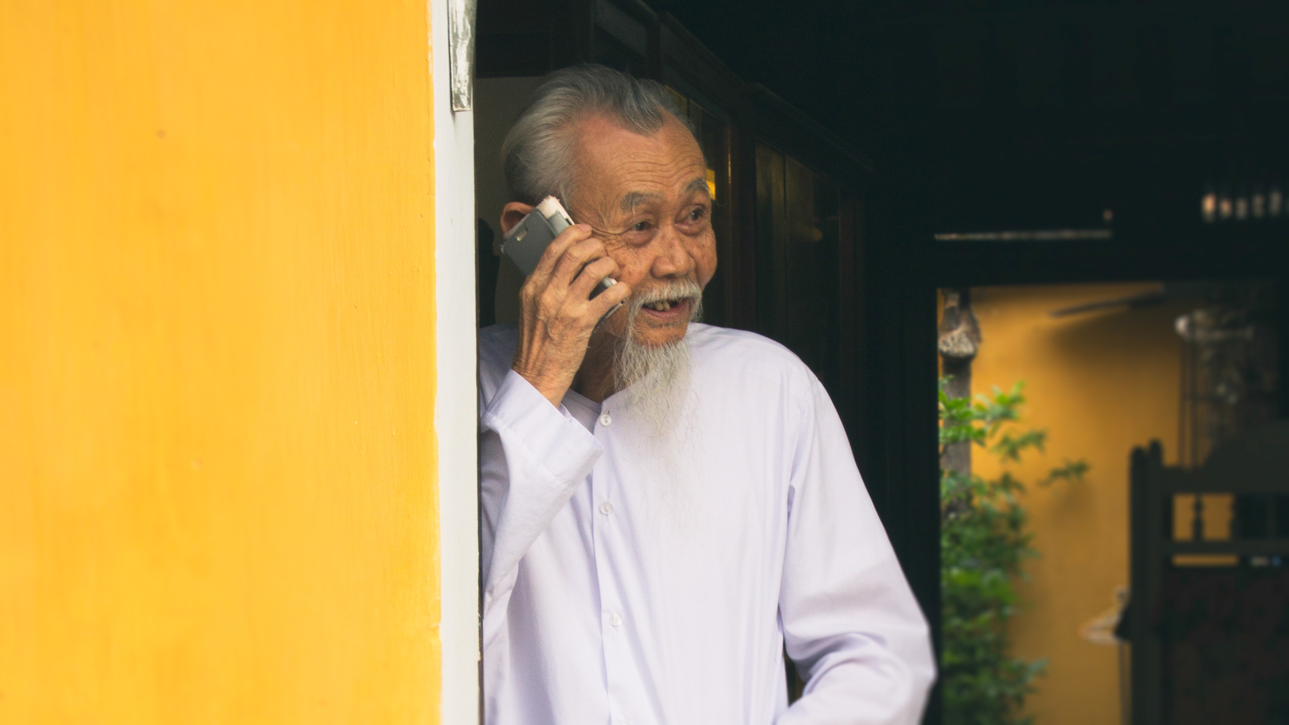 Vietnam photography holiday Hoi An old shopkeeper